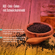 Ein Holzlöffel und eine Schale mit Schwarzkümmelsamen stehen neben einem Glas mit Öl. Der Text hebt hervor, wie die ACE + Selen + Zink Schwarzkümmelöl Kapseln von FITNE Health Care das Immunsystem unterstützen und die Gesundheit fördern.