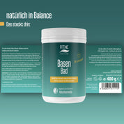 Eine Dose FITNE Health Care Basen-Bad zeigt auf ihrem grün-weißen Etikett eine Produktinformation in deutscher Sprache mit der Botschaft "Sei du selbst" sowie Angaben zu Bio-Jojobaöl, Inhaltsstoffen und Anwendungshinweisen.